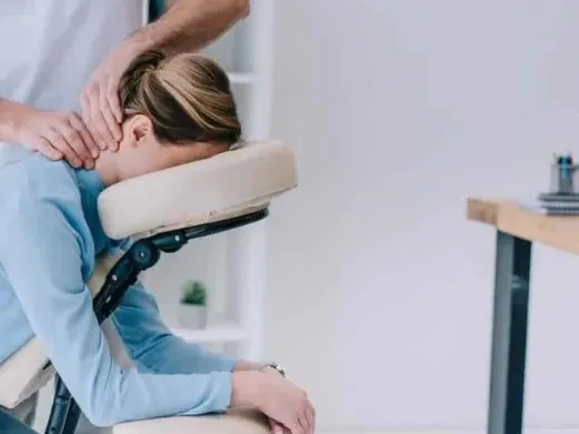 Therapist performing manual neck therapy on a patient
